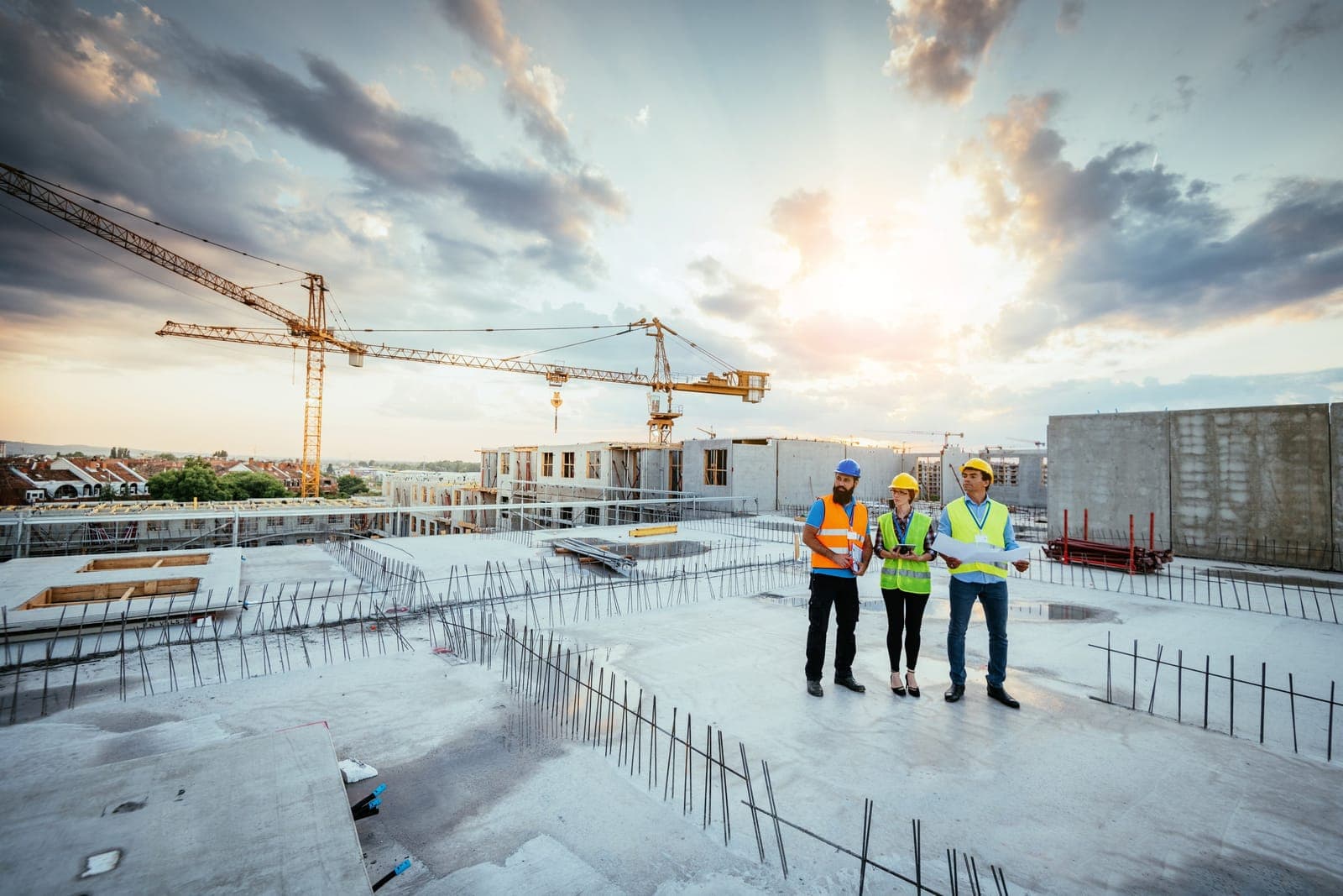 Team on an industrial site at sunset